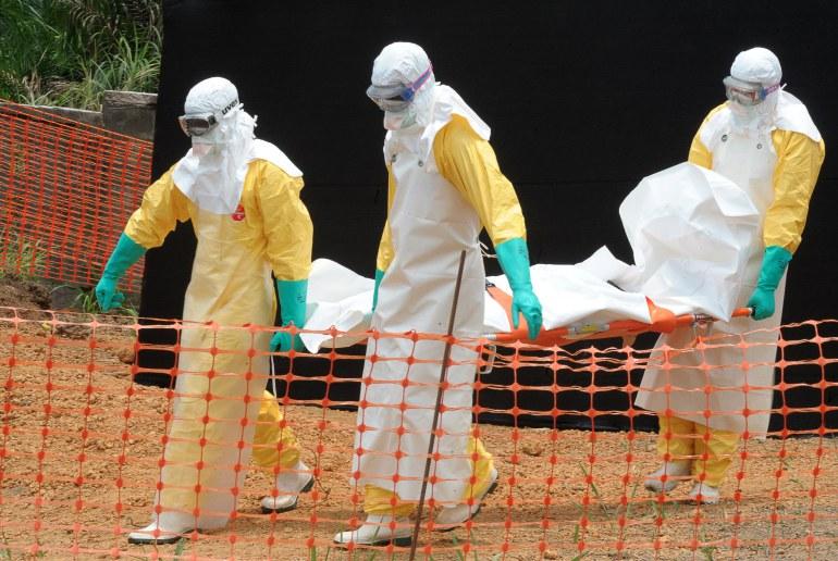 Workers for the charity organization Doctors Without Borders carry a body killed by the Ebola virus early this April.