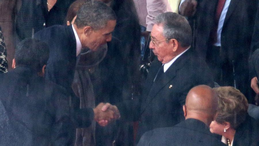  Obama (left) and Castro (right) seen together at Nelson Mandela’s funeral. The first handshake between American and Cuban leaders in over 50 years.