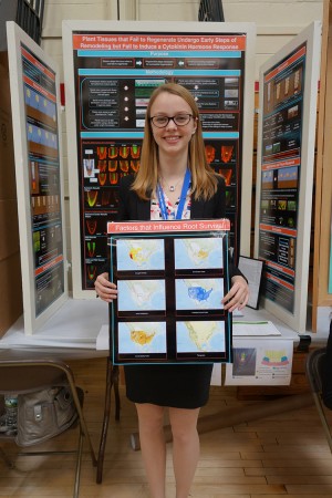 Charlotte Keeley, finalist in both the WESEF and JSHS competitions, holds up her winning display