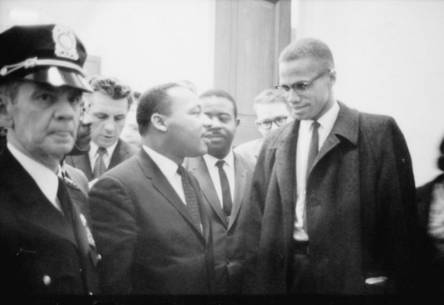 "No Known Restrictions: 'Martin Luther King and Malcolm X Waiting for Press Conference' by Marion S. Trikosko, March 26, 1964 (LOC)" by pingnews.com is marked with CC PDM 1.0